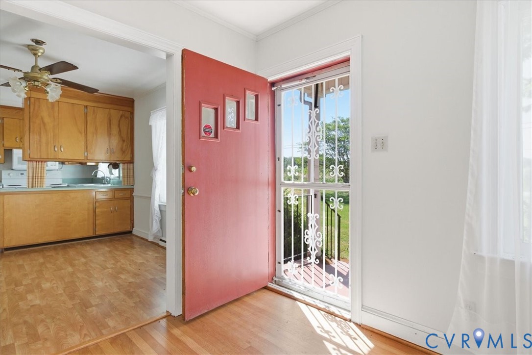 8100 Sandy Ridge Road Hopewell, VA 23860 - Photo 5 of 36 Red entry door with decorative glass inserts and s