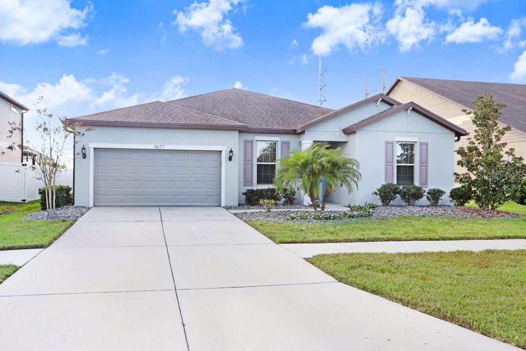 11677 Brighton Knoll Loop Riverview, FL 33579 - Photo 1 of 30 a front view of a house with garden