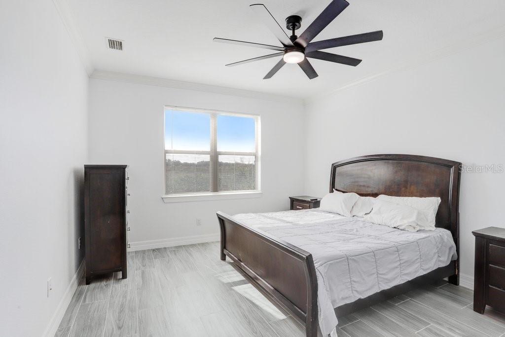 11677 Brighton Knoll Loop Riverview, FL 33579 - Photo 12 of 30 a bedroom with a bed and a window