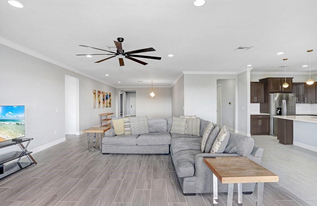 11677 Brighton Knoll Loop Riverview, FL 33579 - Photo 17 of 30 a living room with furniture and a table