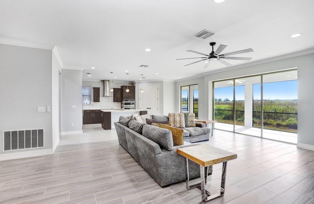 11677 Brighton Knoll Loop Riverview, FL 33579 - Photo 18 of 30 a living room with furniture and a large window