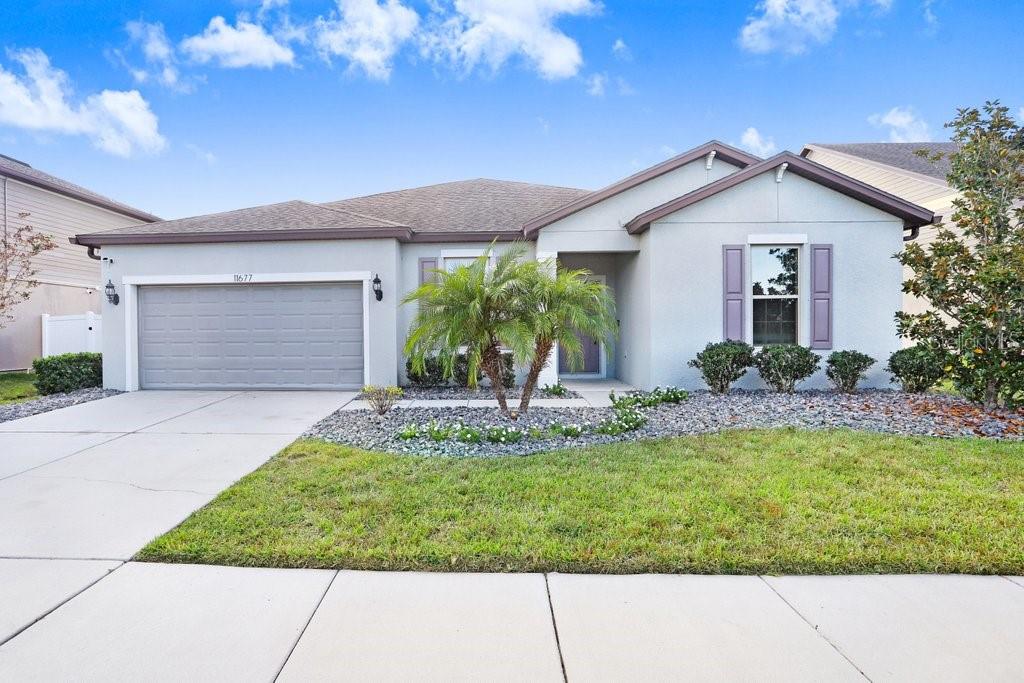 11677 Brighton Knoll Loop Riverview, FL 33579 - Photo 2 of 30 a view of a house with backyard and garden
