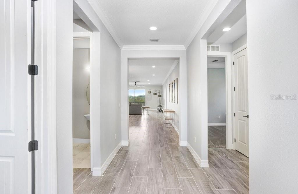 11677 Brighton Knoll Loop Riverview, FL 33579 - Photo 3 of 30 a view of a hallway with wooden floor