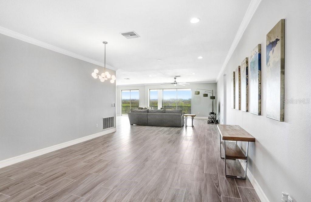 11677 Brighton Knoll Loop Riverview, FL 33579 - Photo 4 of 30 a living room with furniture and a wooden floor