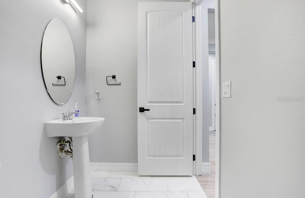11677 Brighton Knoll Loop Riverview, FL 33579 - Photo 8 of 30 a bathroom with a sink a mirror and a mirror