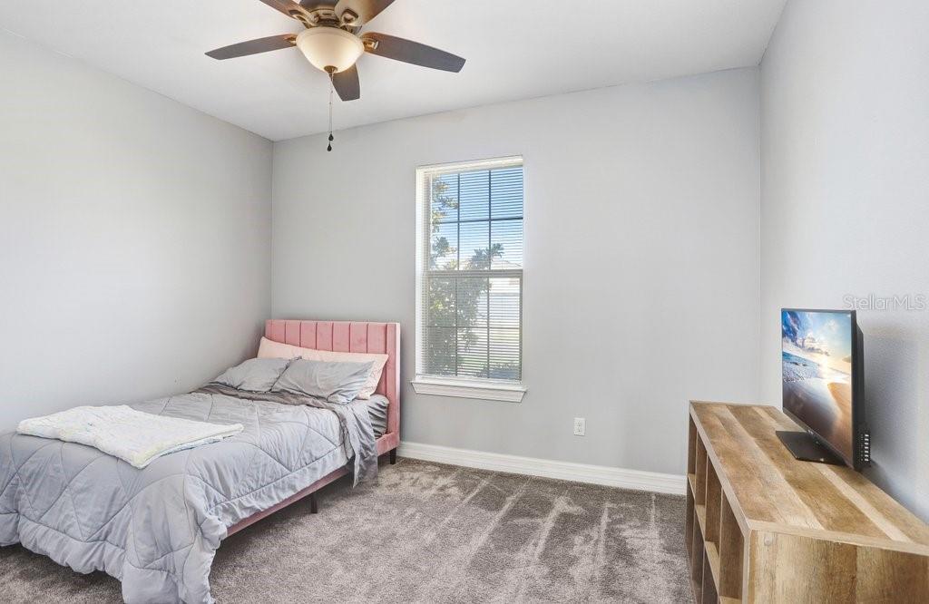 11677 Brighton Knoll Loop Riverview, FL 33579 - Photo 9 of 30 a bedroom with a bed and window