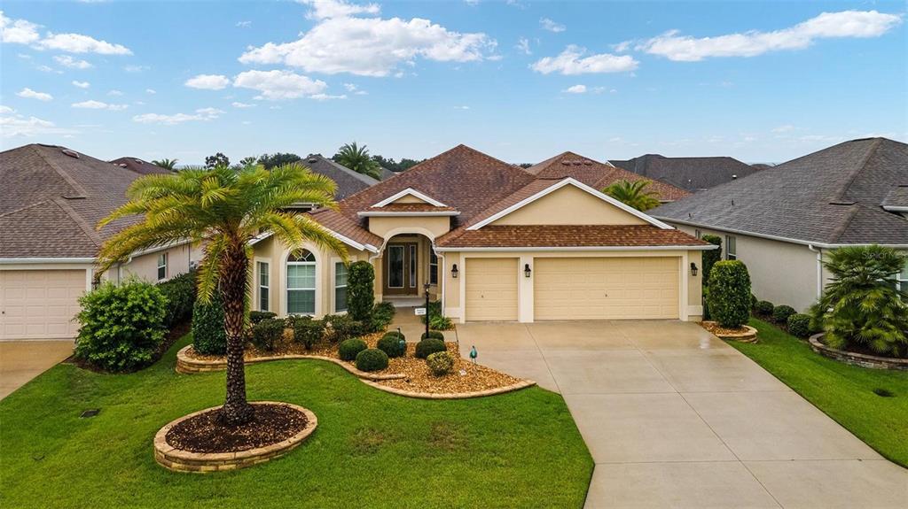 3571 Infinity Run The Villages, FL 32163 - Photo 1 of 1 a front view of house with yard and green space