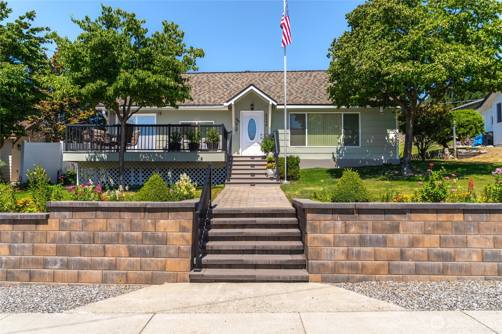 2548 Entiat Way Entiat, WA 98822 - Photo 1 of 40 a front view of a house with a garden