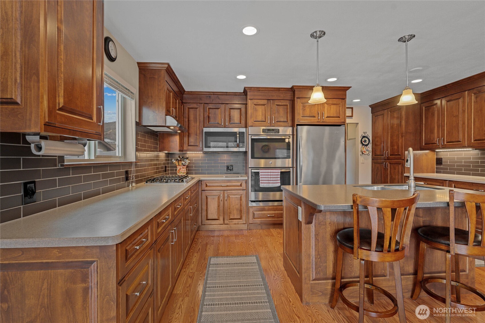 2548 Entiat Way Entiat, WA 98822 - Photo 12 of 40 a kitchen with stainless steel appliances granite countertop a sink a stove and a refrigerator
