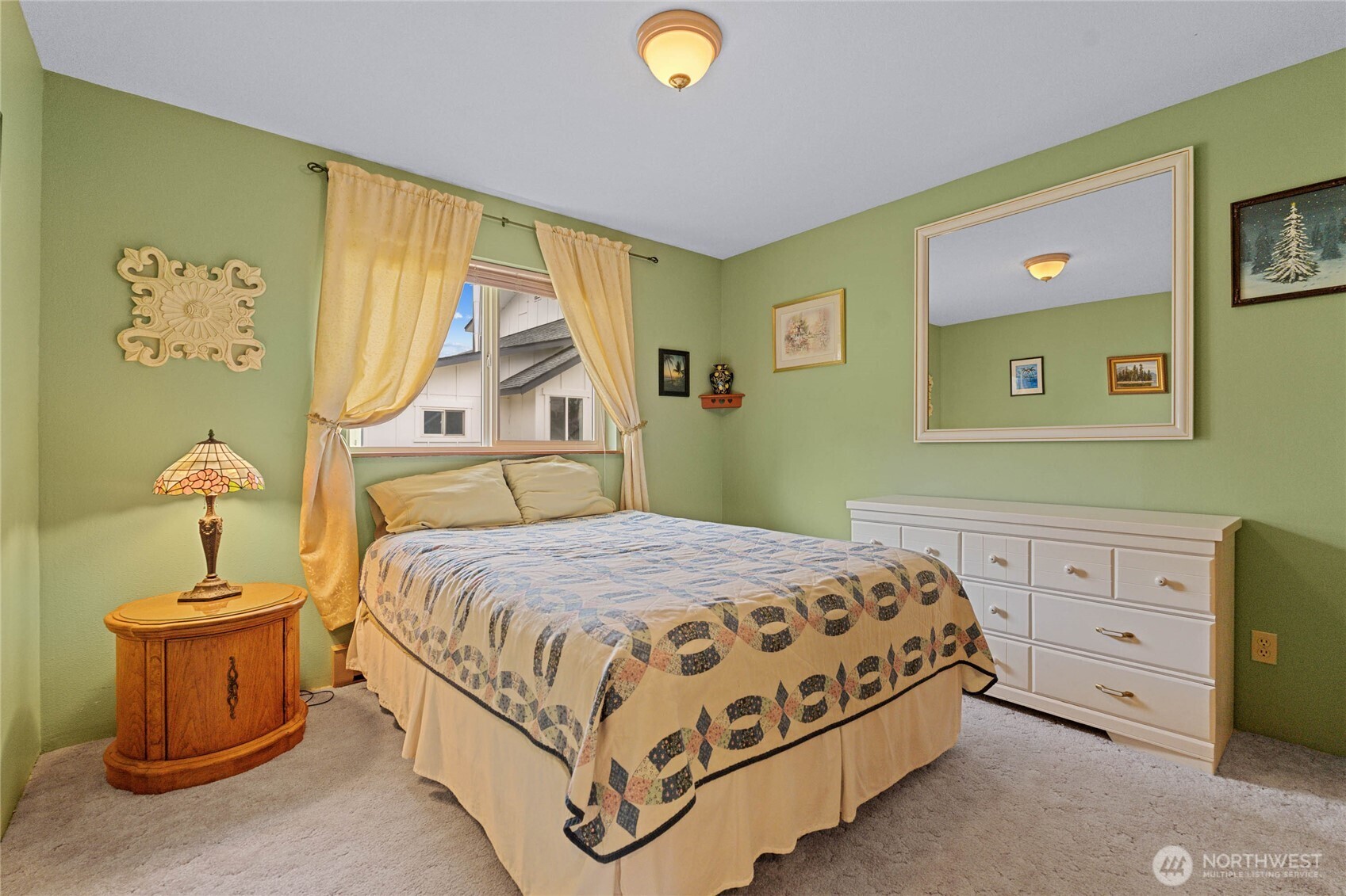 2548 Entiat Way Entiat, WA 98822 - Photo 17 of 40 a bedroom with a bed and a chandelier