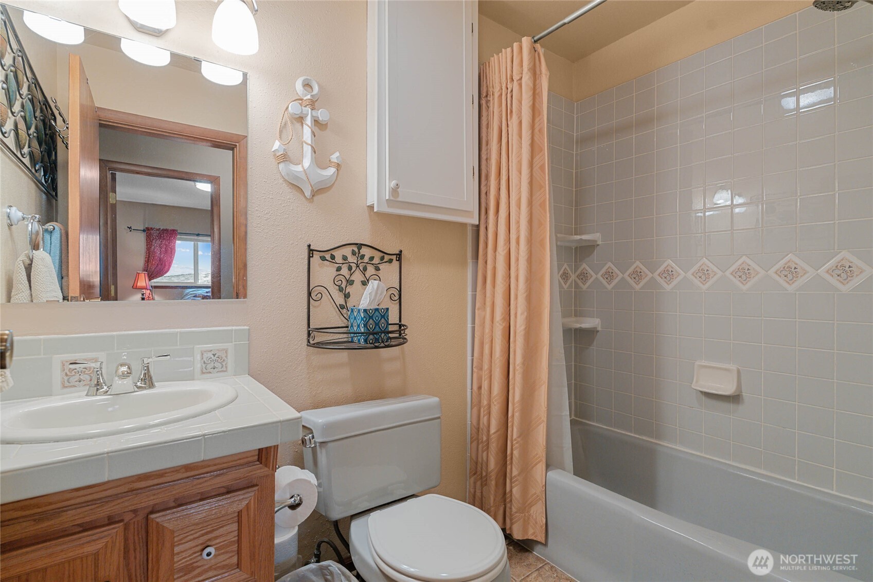 2548 Entiat Way Entiat, WA 98822 - Photo 22 of 40 a bathroom with a sink a toilet and shower
