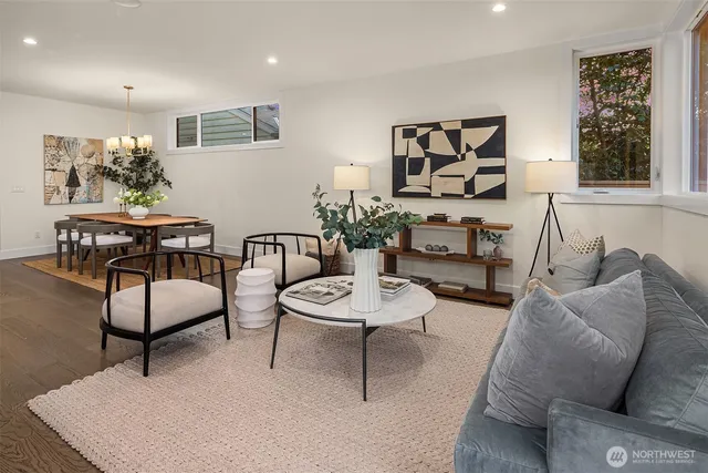 a living room with furniture and a potted plant