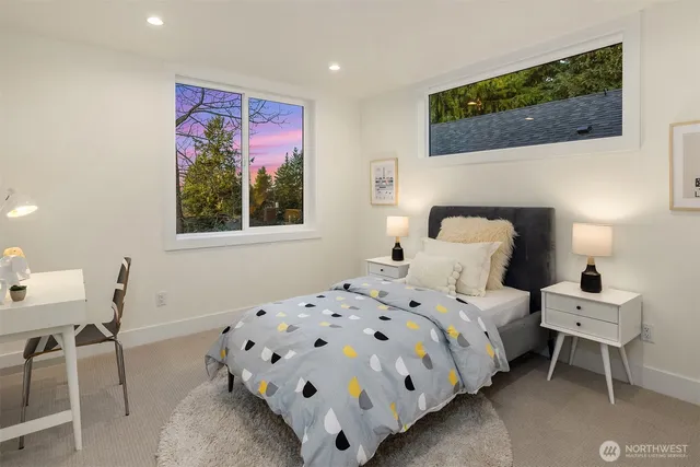 a bedroom with a bed and a chair