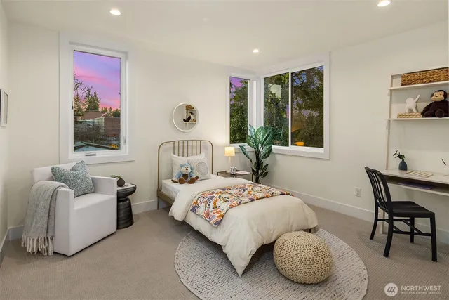 a bedroom with bed and a window