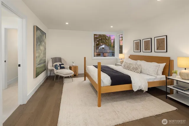 a bedroom with a bed and a couch