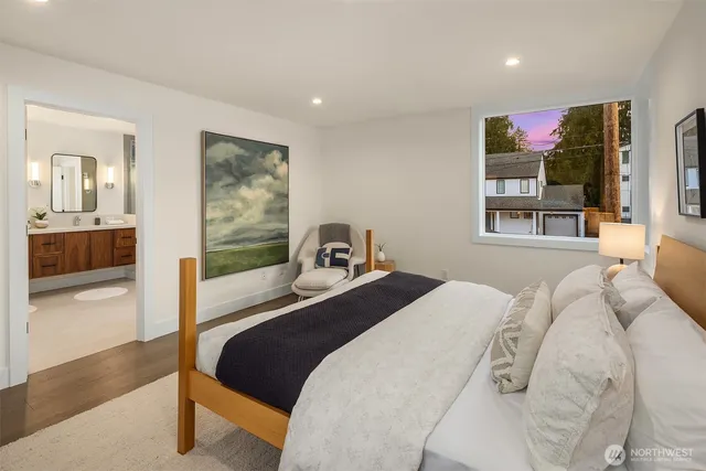 a bedroom with a bed and glass walk in closet