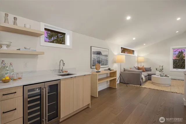 a kitchen with stainless steel appliances a sink stove and cabinets