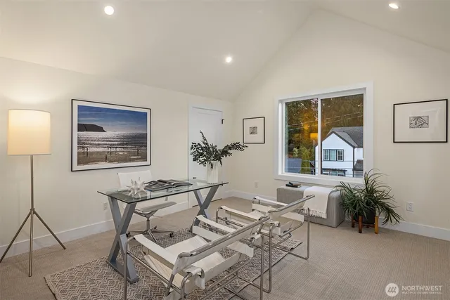 a living room with furniture a lamp and a potted plant