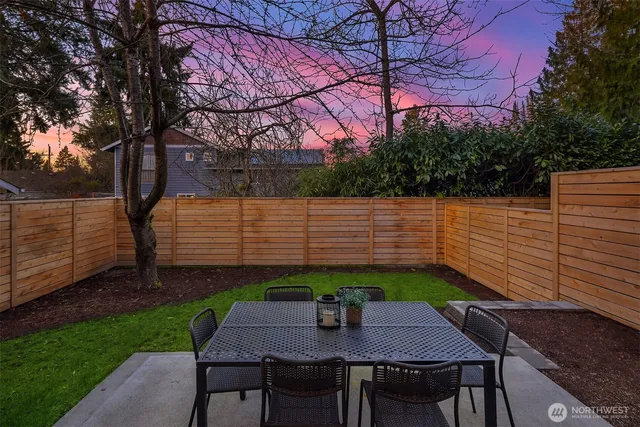 a view of a backyard with sitting area