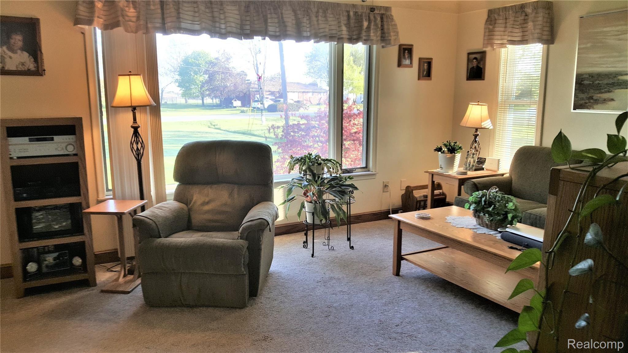 8773 US Turnpike Road Newport, MI 48166 - Photo 11 of 32 Living room with large windows for lots of light.