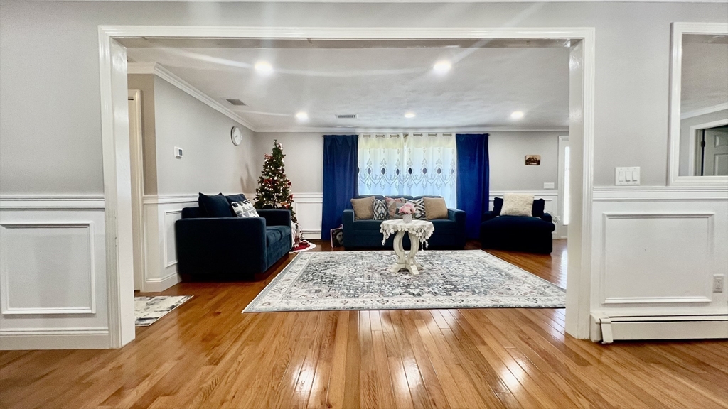5 Flintlocke Road Franklin, MA 02038 - Photo 11 of 34 a living room with furniture and a wooden floor