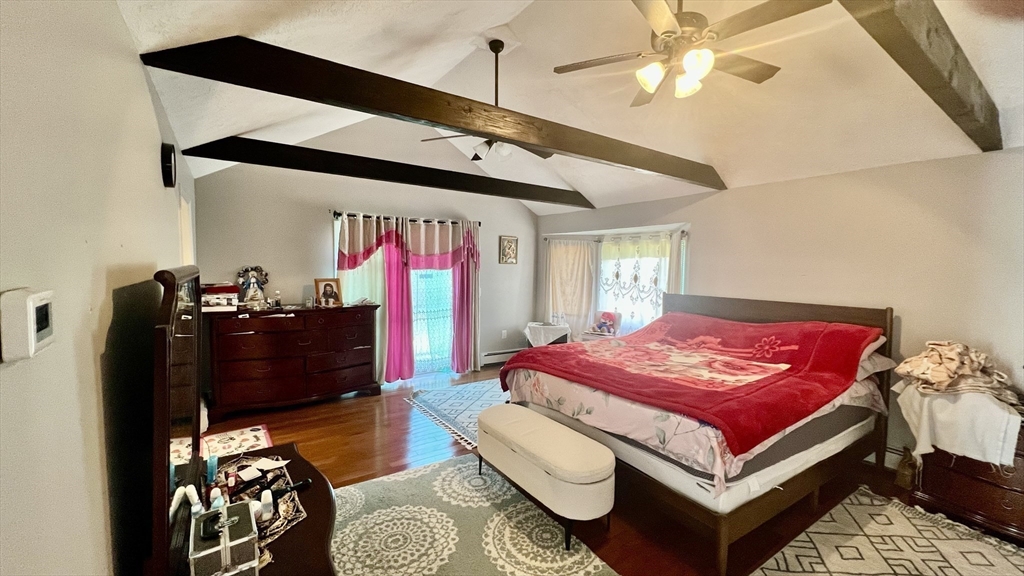 5 Flintlocke Road Franklin, MA 02038 - Photo 15 of 34 a bedroom with a bed and wooden floor