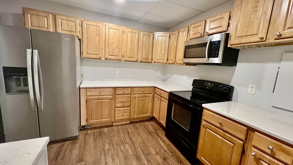 5 Flintlocke Road Franklin, MA 02038 - Photo 20 of 34 a kitchen with stainless steel appliances a refrigerator sink and microwave