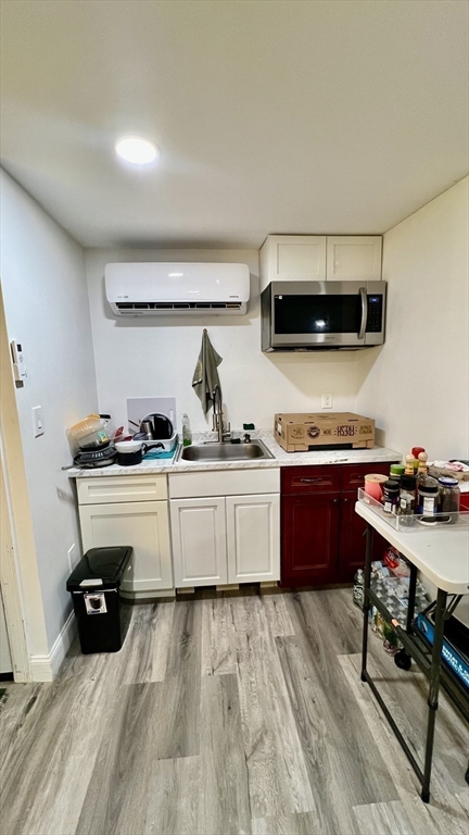 5 Flintlocke Road Franklin, MA 02038 - Photo 22 of 34 a kitchen with a sink and a stove top oven