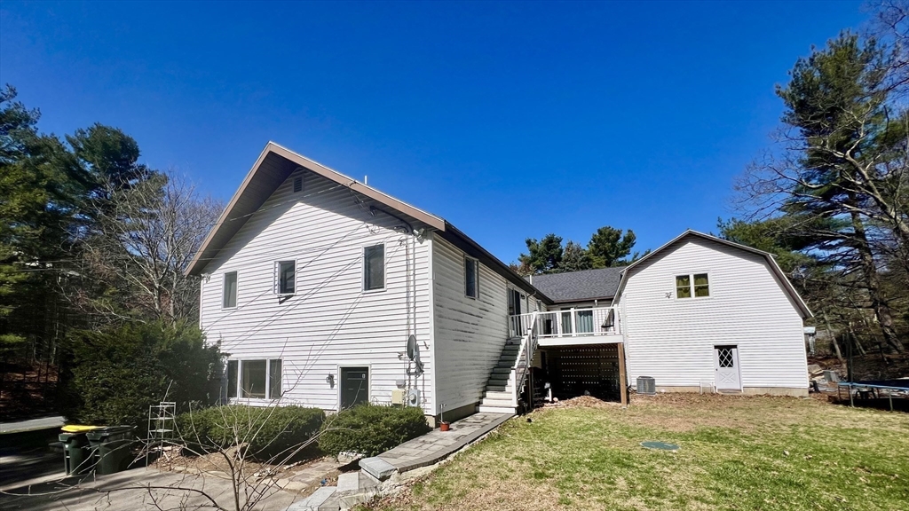 5 Flintlocke Road Franklin, MA 02038 - Photo 28 of 34 a view of a white house with a yard