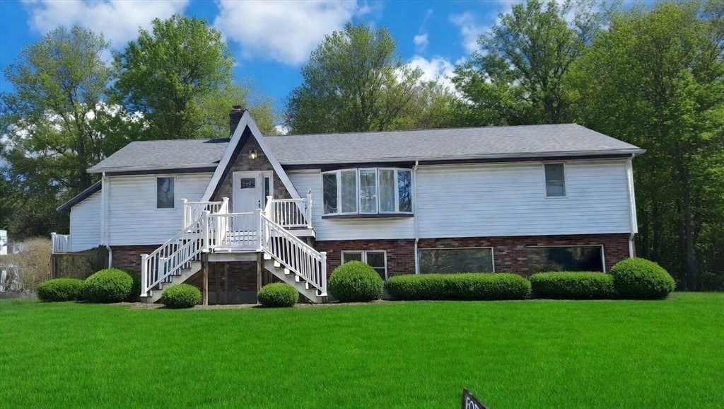5 Flintlocke Road Franklin, MA 02038 - Photo 29 of 34 a front view of a house with a yard and green space