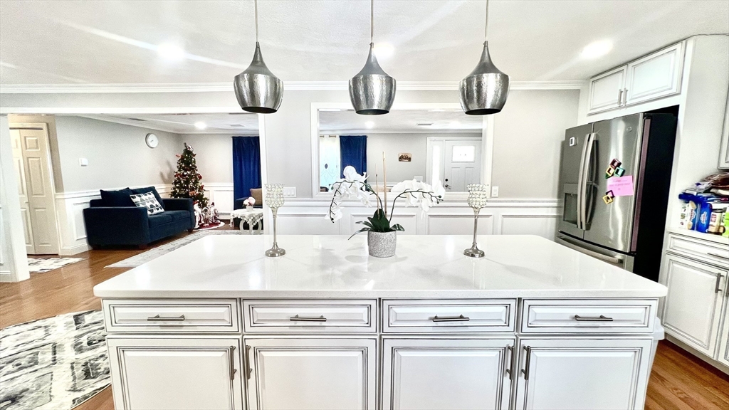 5 Flintlocke Road Franklin, MA 02038 - Photo 8 of 34 a view of kitchen with stainless steel appliances granite countertop a stove and a chandelier