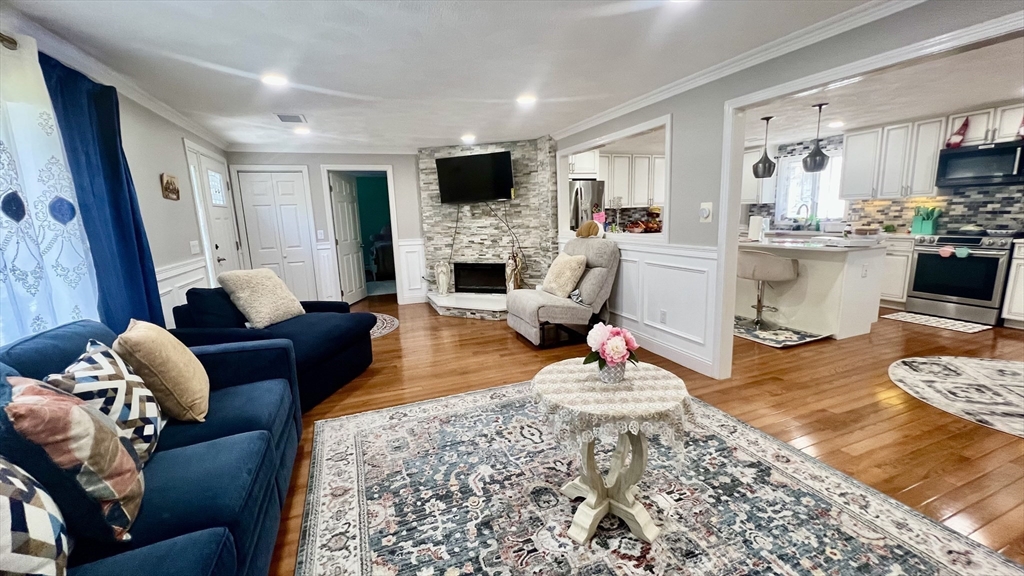 5 Flintlocke Road Franklin, MA 02038 - Photo 9 of 34 a living room with furniture and a fireplace