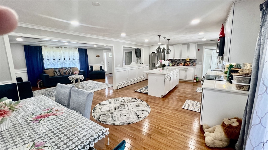 5 Flintlocke Road Franklin, MA 02038 - Photo 10 of 34 a living room with furniture and a table