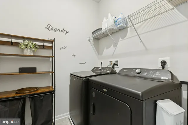 a view of a hallway with wooden floor and white walls