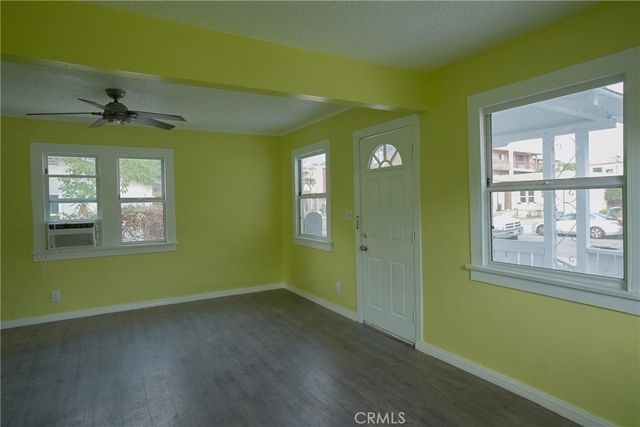a view of empty room with windows