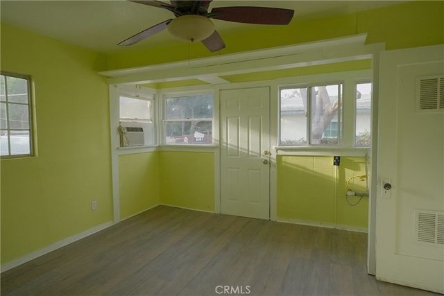 a view of empty room with window and entryway