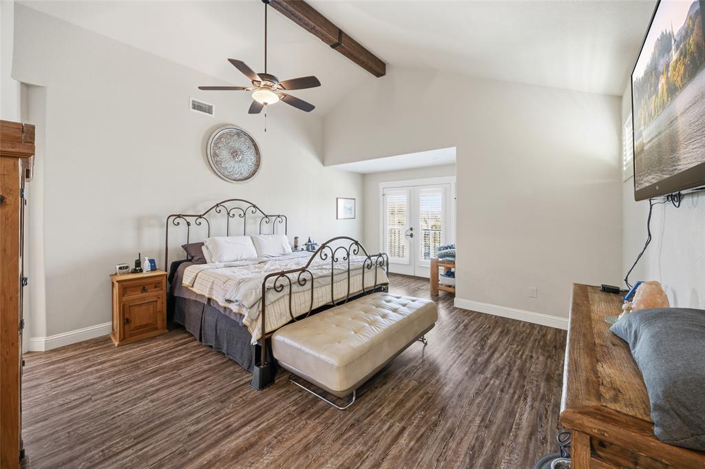 3105 Pastor Street Dallas, TX 75212 - Photo 5 of 28 Primary Bedroom with Luxury Vinyl wood like floors, ceiling fan, and access to exterior balcony