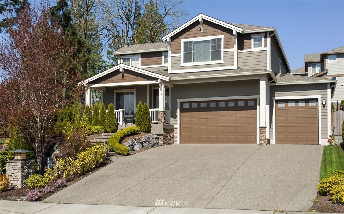 6100 Southeast 2nd Street Renton, WA 98059 - Photo 1 of 24 a front view of a house with yard and porch