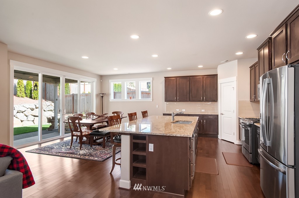 6100 Southeast 2nd Street Renton, WA 98059 - Photo 11 of 24 a view of a dining room with furniture window and wooden floor