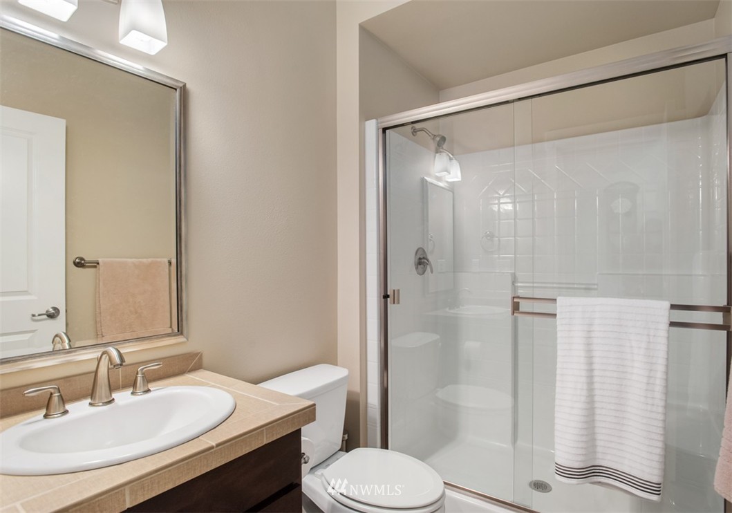 6100 Southeast 2nd Street Renton, WA 98059 - Photo 13 of 24 a bathroom with a sink toilet and shower