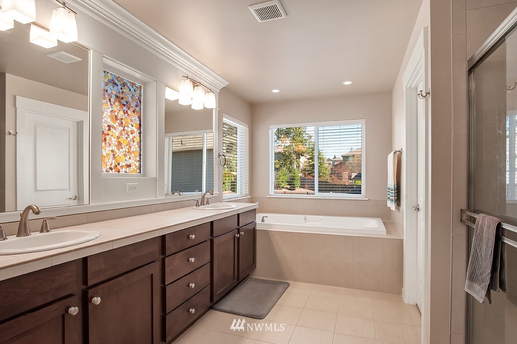 6100 Southeast 2nd Street Renton, WA 98059 - Photo 15 of 24 a bathroom with a large tub sink and mirror