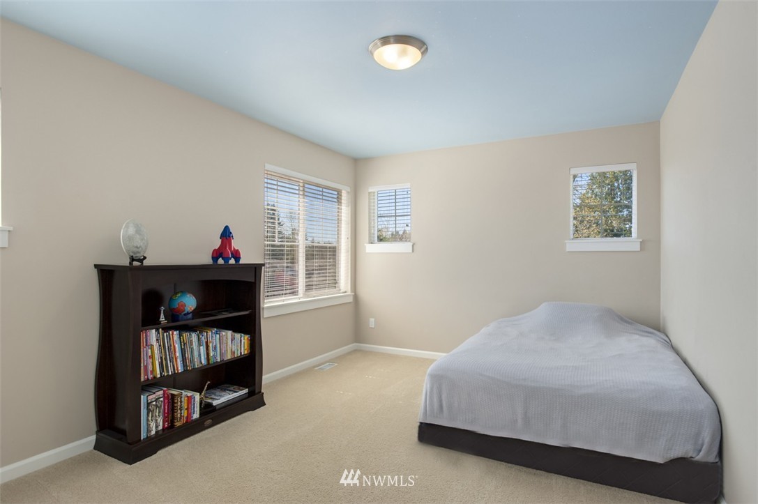 6100 Southeast 2nd Street Renton, WA 98059 - Photo 16 of 24 a bedroom with a bed and a window