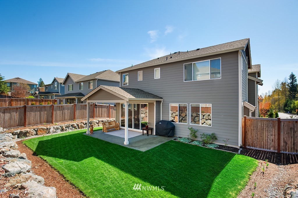 6100 Southeast 2nd Street Renton, WA 98059 - Photo 23 of 24 a front view of a house with a yard and green space