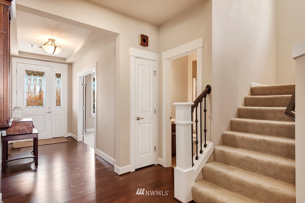 6100 Southeast 2nd Street Renton, WA 98059 - Photo 4 of 24 a view of an entryway with wooden floor and stairs