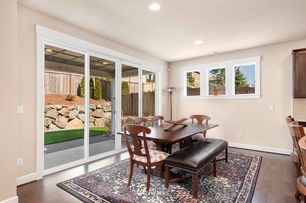 6100 Southeast 2nd Street Renton, WA 98059 - Photo 10 of 24 a dining room with furniture and wooden floor