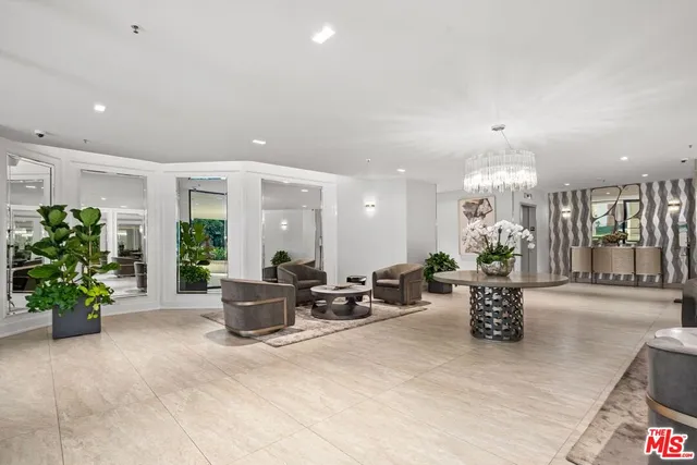 a living room with furniture potted plant and a window
