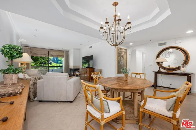 a view of a livingroom with furniture window and wooden floor