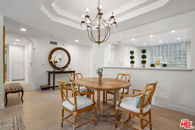 a kitchen with stainless steel appliances a stove a sink and a refrigerator