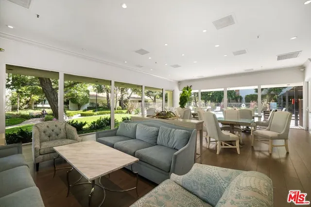 a view of a swimming pool with chairs