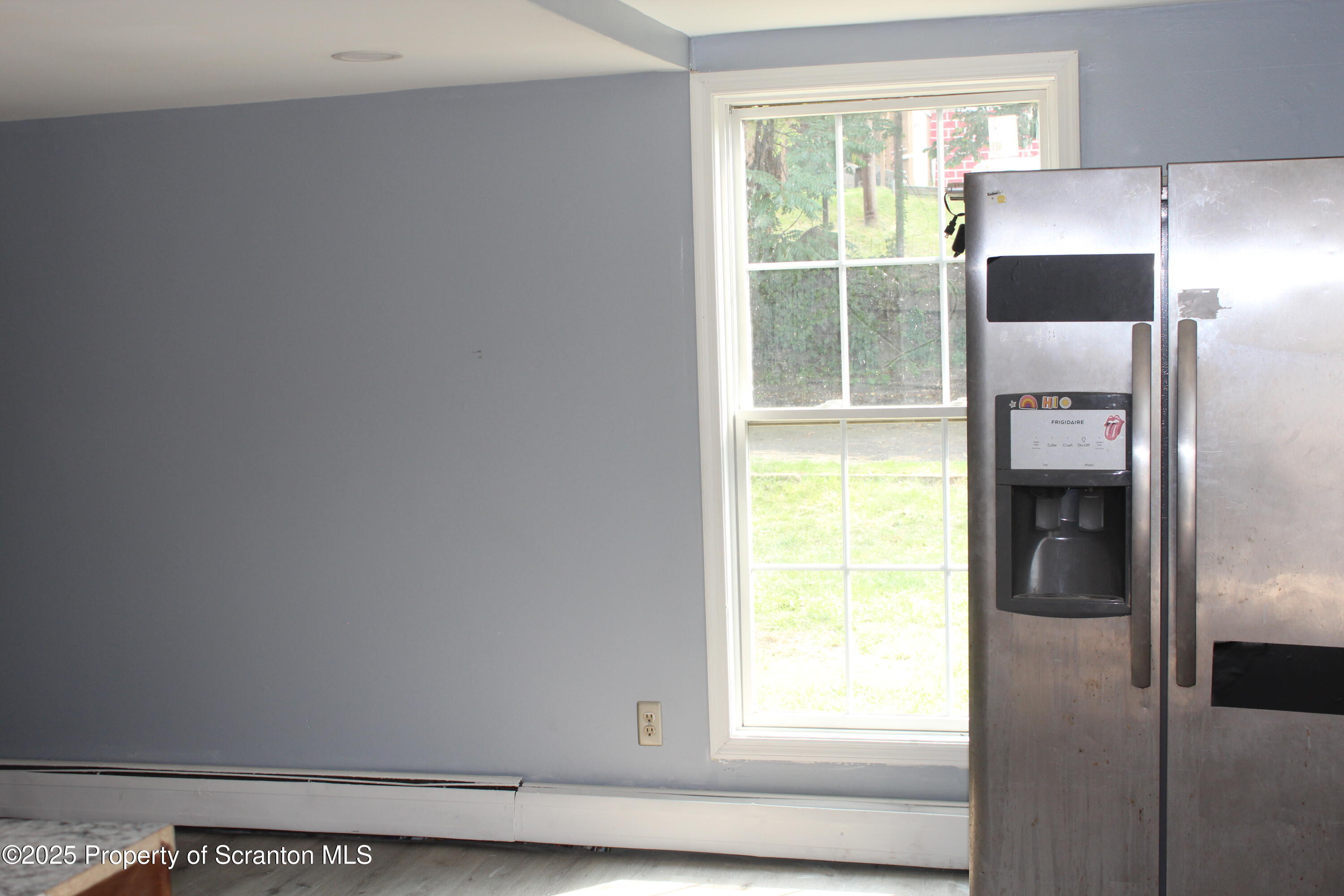 1507 Luzerne Street Scranton, PA 18504 - Photo 6 of 26 a kitchen with a window a refrigerator and washer